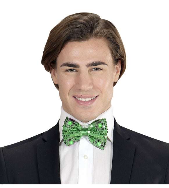 Vihreä keula paljetteja valolla