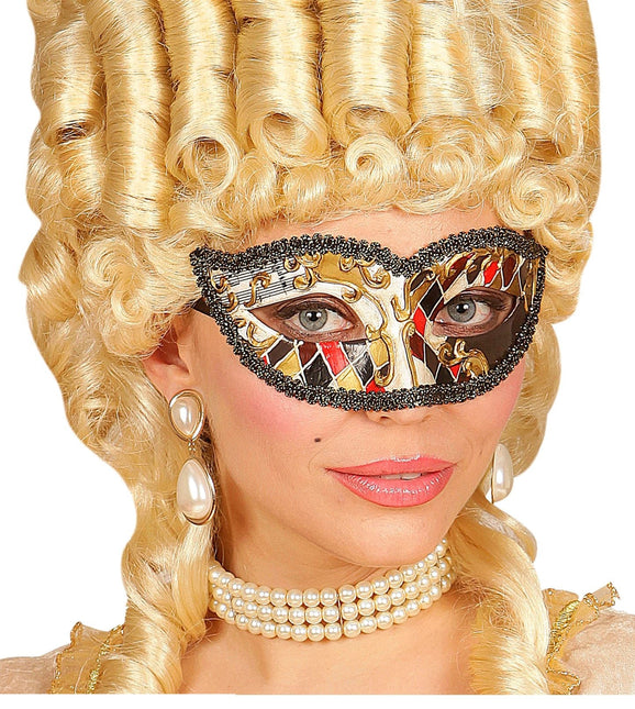 Musta kultainen silmänympärysnaamio